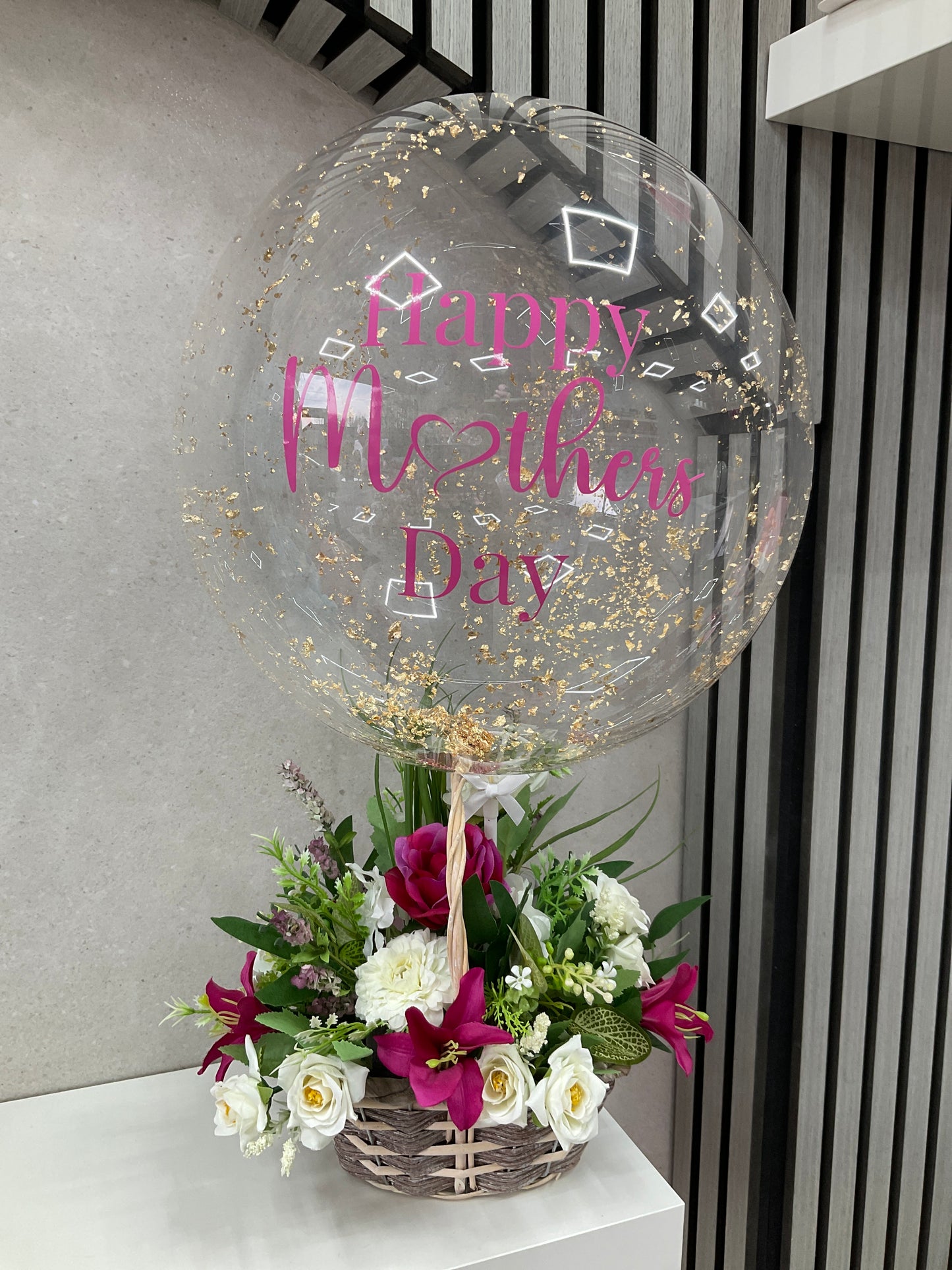 Floral basket with balloon