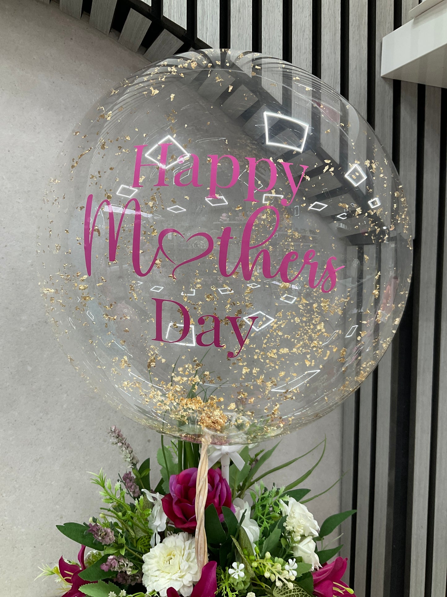 Floral basket with balloon