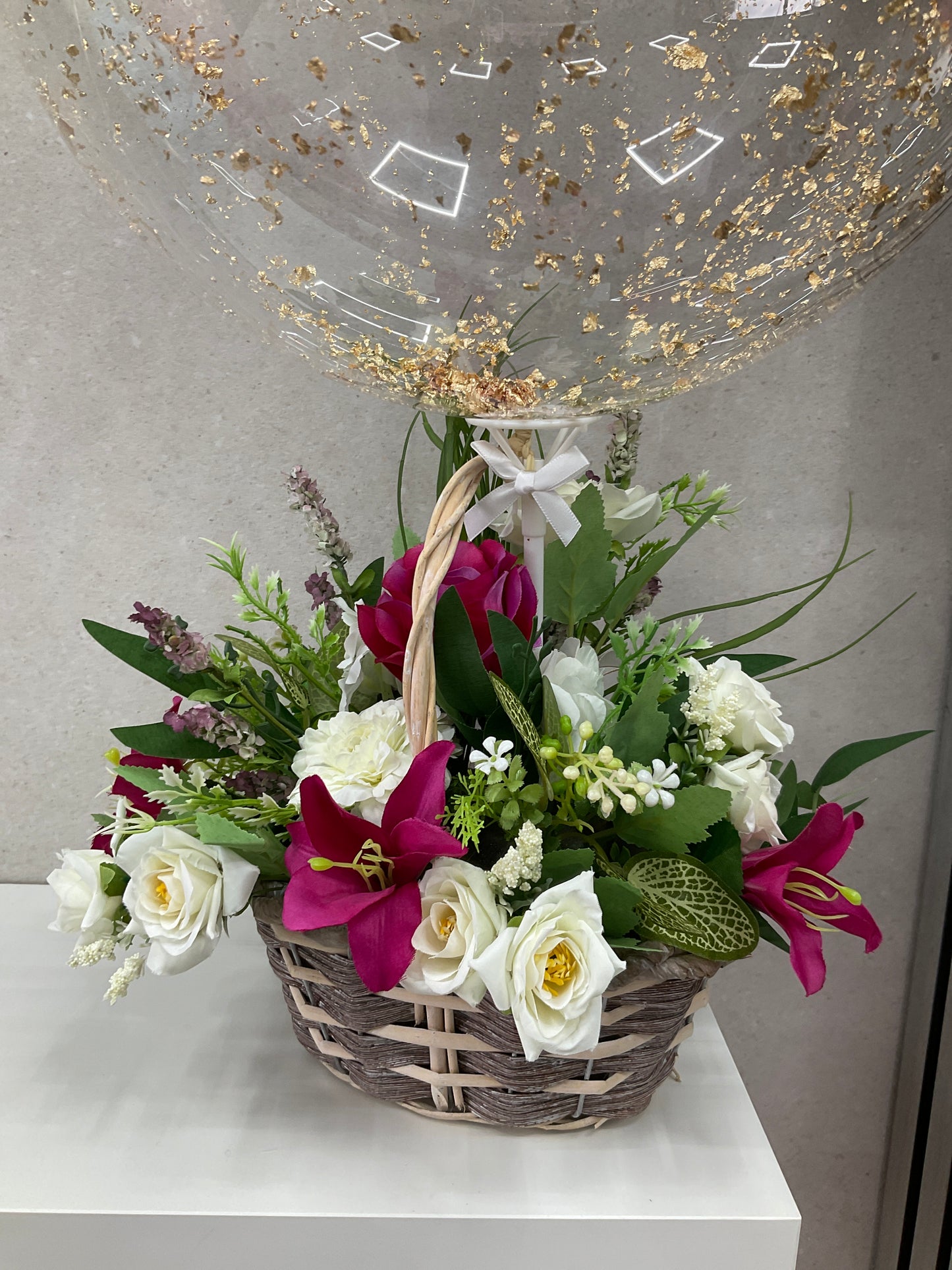 Floral basket with balloon