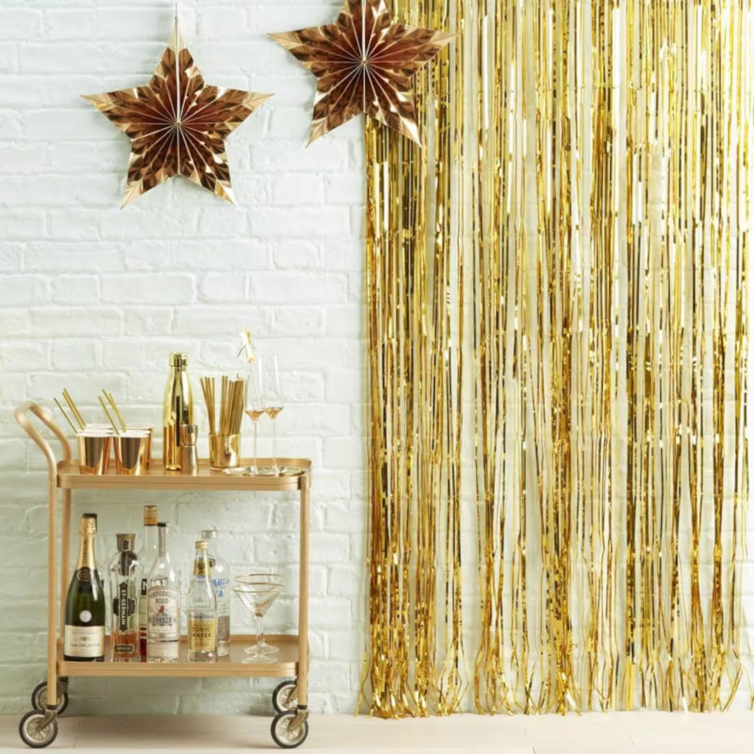 Gold metallic foil curtain backdrop for birthdays, weddings, baby showers, anniversaries, party decorations and photo booth backgrounds.