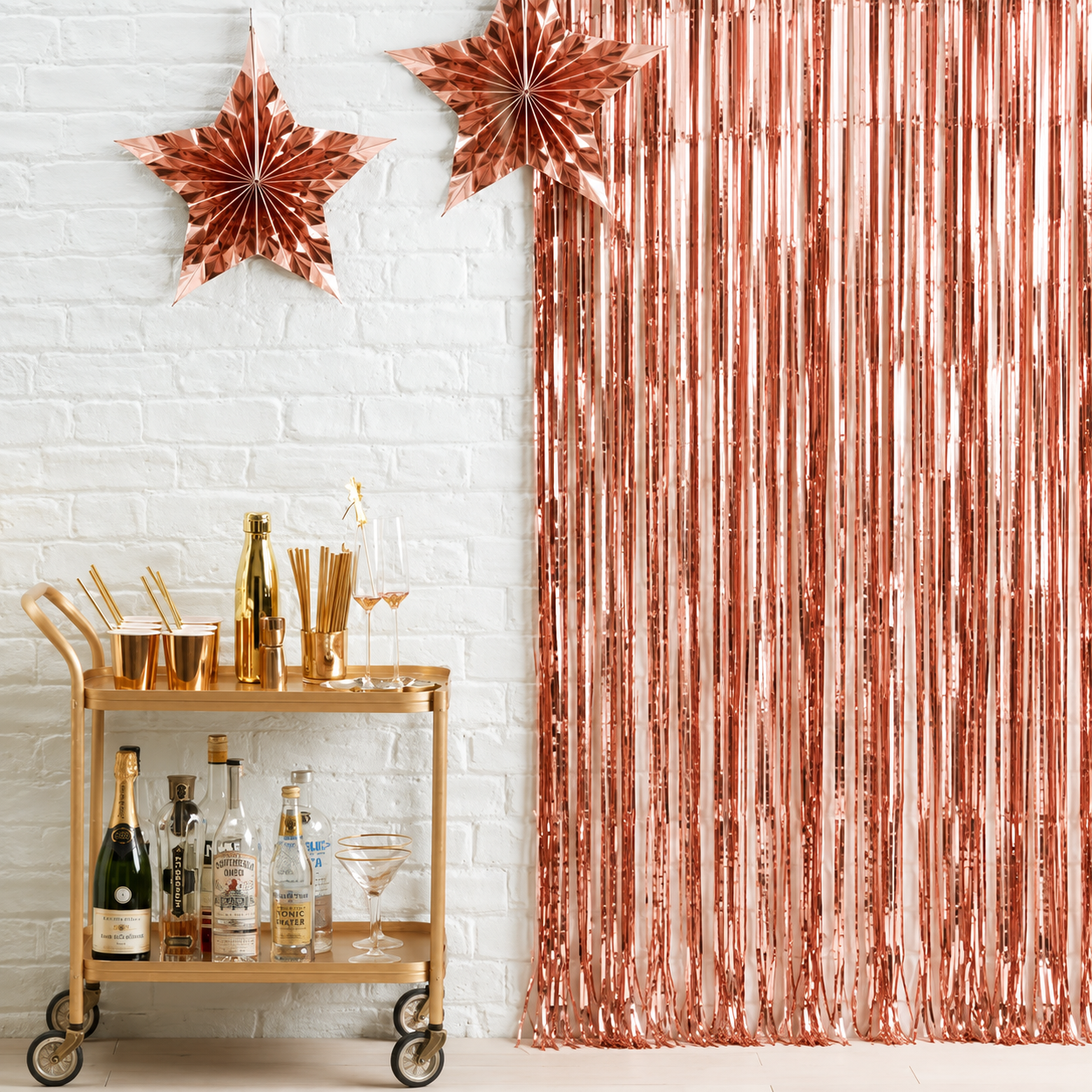 Rose gold metallic foil curtain backdrop for birthdays, weddings, baby showers, bridal showers, party decorations and photo booth backgrounds.