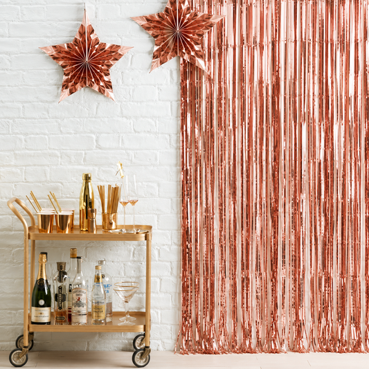 Rose gold metallic foil curtain backdrop for birthdays, weddings, baby showers, bridal showers, party decorations and photo booth backgrounds.